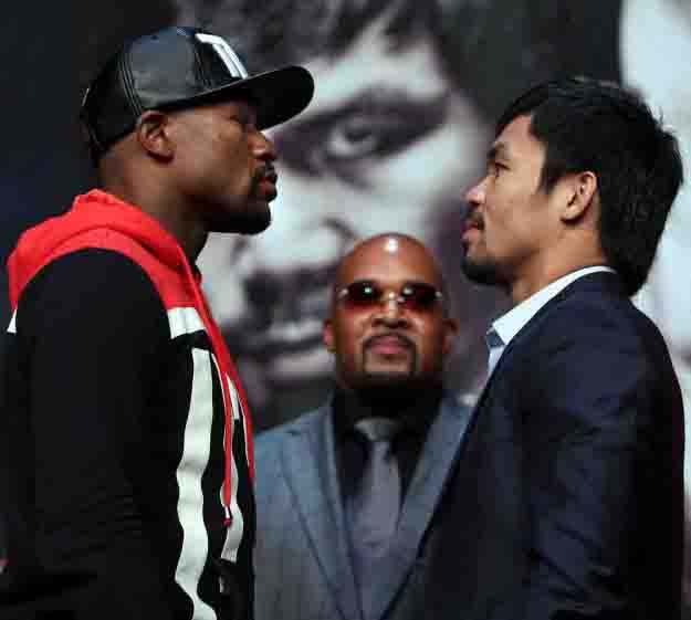 April 29, 2015, Las Vegas,Nevada  ---  Superstar Manny Pacquiao(R) and  and Floyd Mayweather(L) attend the final press conference Wednesday for their upcoming historic 12-round welterweight world championship unification mega-fight.        Promoted by Mayweather Promotions and Top Rank Inc. , this pay-per-view telecast will be co-produced and co-distributed by HBO Pay-Per-View® and SHOWTIME PPV® Saturday, May 2 beginning at 9:00 p.m. ET/ 6:00 p.m. PT from the MGM Grand Garden Arena in Las Vegas.     ---   Photo Credit : Chris Farina - Top Rank (no other credit allowed)  copyright 2015