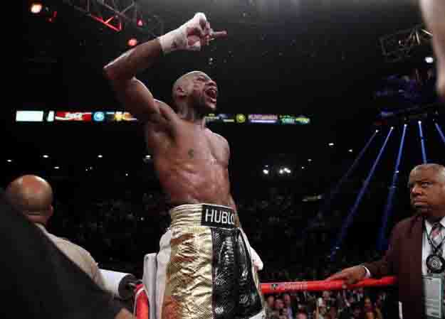 May 2, 2015, Las Vegas,Nevada  ---   Floyd Mayweather wins a 12-round unanimous decieion over Manny Pacquiao Saturday from the MGM Grand Garden Arena in Las Vegas.     ---   Photo Credit : Chris Farina - Top Rank (no other credit allowed)  copyright 2015