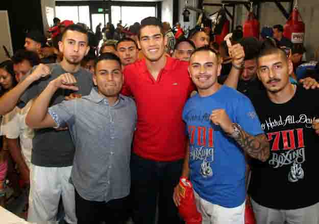 May 31, 2015, Lynwood,Ca.   --- Undefeated Mexican knockout artist and No. 2-world-rated super middleweight contender  Gilberto "Zurdo" Ramirez meets and greets fans during an event for the  WBC : World Boxing Cares in East Los Angeles. Ramirez will headline an all-action card on Friday, June 26, at State Farm Arena in Hidalgo, TX.  Ramirez will be taking on DERECK "The Black Lion" EDWARDS in a 10- round super middleweight bout which will be televised live on The MetroPCS Friday Night Knockout on truTV® at 10:00 p.m. ET.  The live boxing series is presented by truTV and Top Rank®, and produced in association with HBO Sports®.  Find truTV on YOUR TV:  http://trutvishere.com/ Promoted by Top Rank and Zapari Boxing Promotions, in association with Nord Boxing Promotions and Zanfer Promotions,  tickets to the Ramirez-Edwards boxing event are priced at $35, $25, $15, plus VIP tables of ten (10) at $800, $650 and $550, tickets can be purchased at the State Farm Arena box office, online at www.ticketmaster.com or by phone at (956) 843-6688. ---   Photo Credit : Chris Farina - Top Rank (no other credit allowed)  copyright 2015