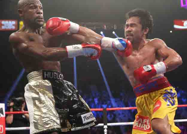 May 2, 2015, Las Vegas,Nevada  ---   Floyd Mayweather wins a 12-round unanimous decieion over Manny Pacquiao Saturday from the MGM Grand Garden Arena in Las Vegas.     ---   Photo Credit : Chris Farina - Top Rank (no other credit allowed)  copyright 2015