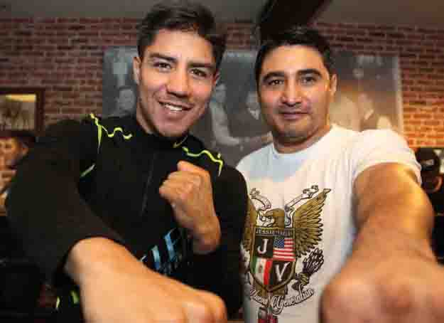 June 24, 2015, Hollywood, Ca.    --  Undefeated WBA super lightweight world champion Jessie Vargas(L) and  trainer/legendary champion Erik Morales(R) work out during media dat at Fortunes Boxing Gym Wednesday for his upcoming title fight against former two-division world champion and highly-rated pound for pound fighter Timothy "Desert Storm" Bradley Jr. , Saturday, June 27, at StubHub Center in Carson, Calif.      Promoted by Top Rank®, in association with Tecate, this exciting event will be televised live on HBO World Championship Boxing, beginning at 9:45 p.m. ET/PT.       ---   Photo Credit : Chris Farina - Top Rank (no other credit allowed)  copyright 2015